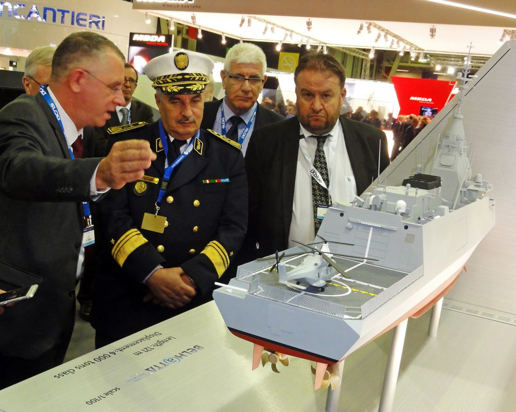 Admiral Mohammed Larbi Haouli, the Algerian National Navy chief of staff is being given explanations about the novel French 4,000-ton Belharra light frigate on the DCNS exhibition stand. © J.-M. Guhl